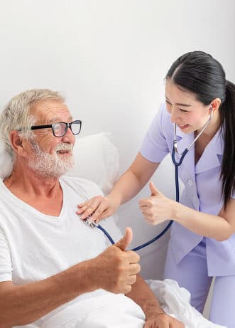 senior man getting a check up from nurse