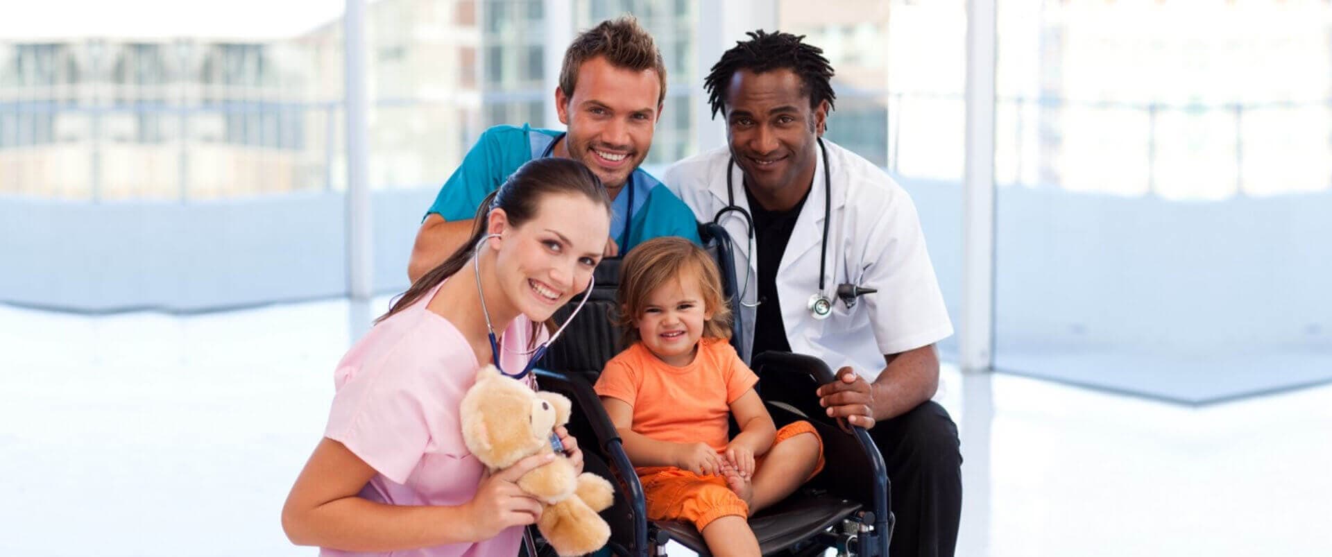 nurses and doctor with little boy