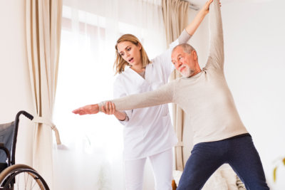 Senior woman with her caregiver at home